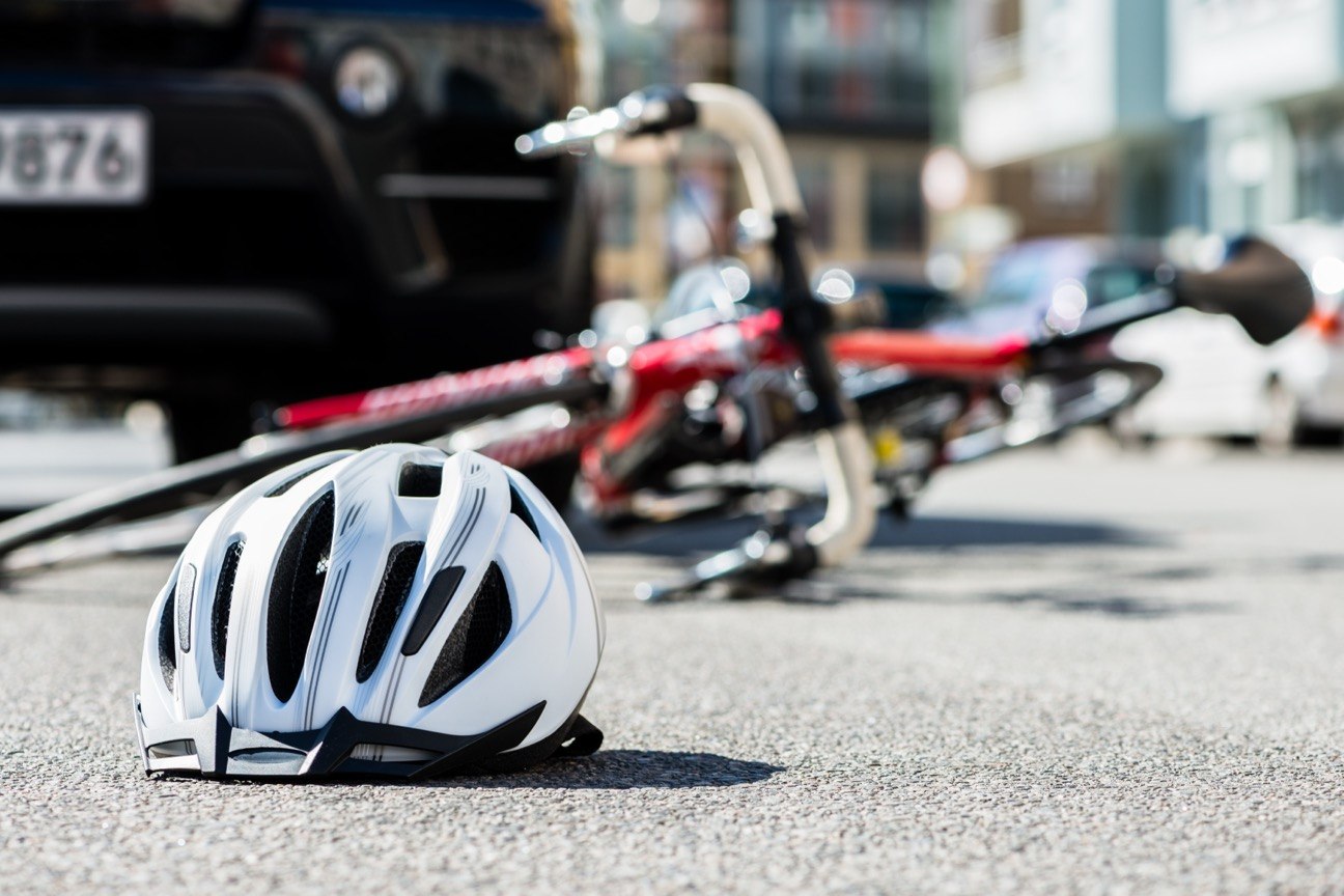 bicycle helmet and bicycle after a crash